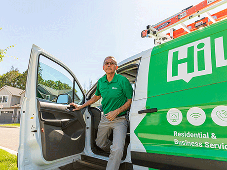 A HiLight employee exiting a HiLight branded vehicle